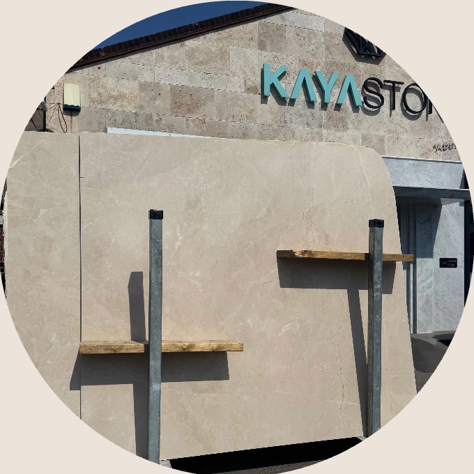 A marble slab on stands outside the Kayastone building.